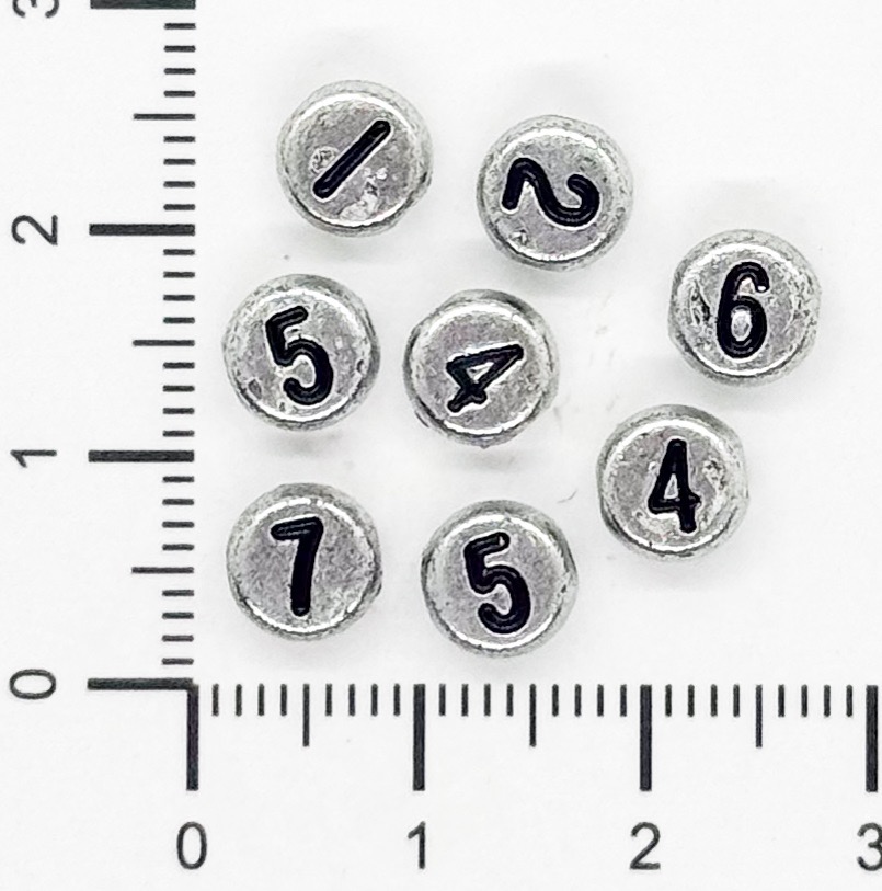 Plástico números plano 7mm plateado x 10 grs.