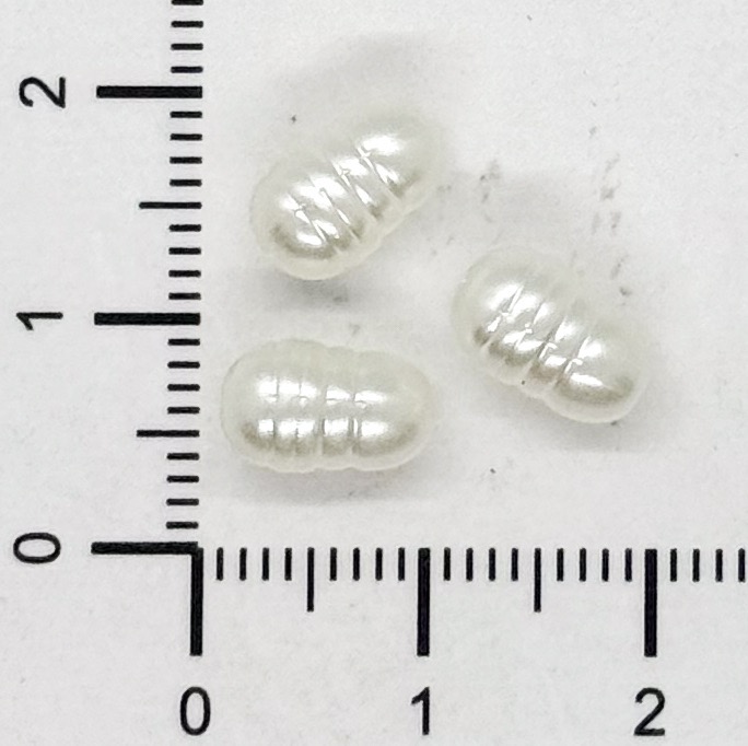 Perla de río plástica irregular chica 10x6mm x 10gr.