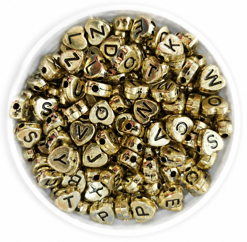 Plástico letras corazón dorado c/negro 7mm  x 10gr. 